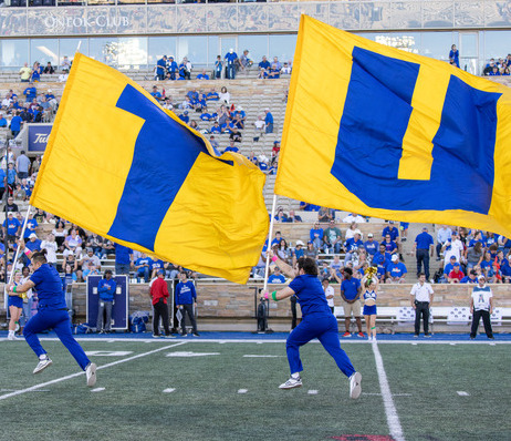 Photograph of TU flags before a football game